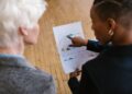 Photo by RDNE Stock project: https://www.pexels.com/photo/woman-pointing-finger-on-a-white-paper-with-graphs-7414286/