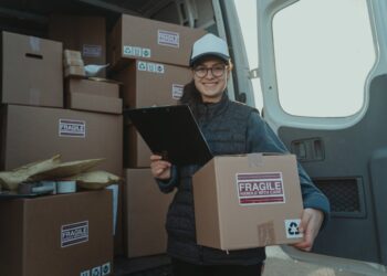 Photo by Tima Miroshnichenko: https://www.pexels.com/photo/female-courier-carrying-a-box-and-holding-a-clipboard-6169673/
