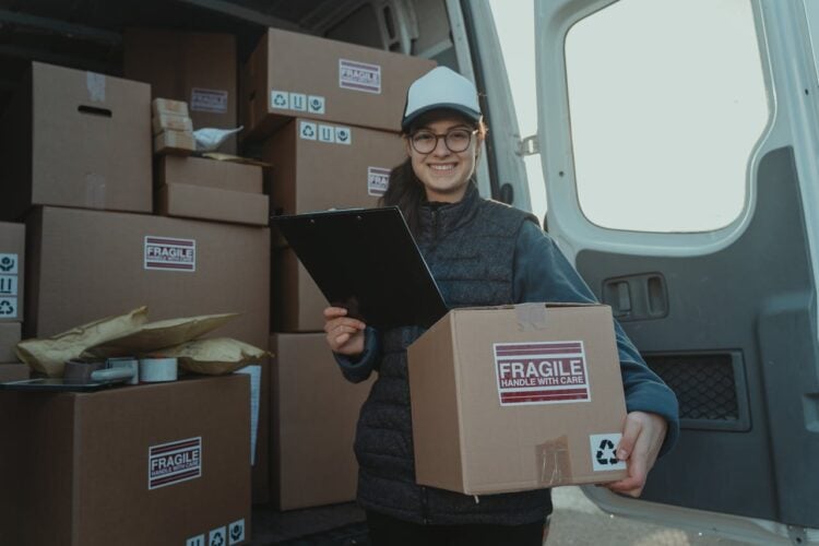 Photo by Tima Miroshnichenko: https://www.pexels.com/photo/female-courier-carrying-a-box-and-holding-a-clipboard-6169673/
