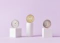 Photo by DS stories: https://www.pexels.com/photo/medals-on-pedestal-on-pink-studio-background-7267588/