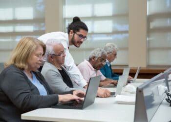 Photo by Kampus Production: https://www.pexels.com/photo/a-man-teach-a-group-of-elderly-to-use-a-laptop-7983552/