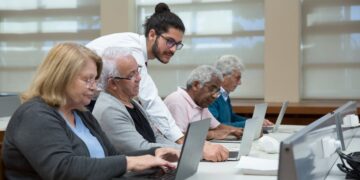 Photo by Kampus Production: https://www.pexels.com/photo/a-man-teach-a-group-of-elderly-to-use-a-laptop-7983552/