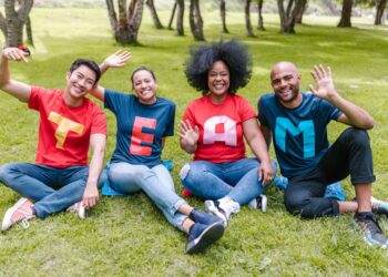 Photo by RDNE Stock project: https://www.pexels.com/photo/people-sitting-on-green-grass-waving-their-hands-7551760/