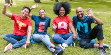Photo by RDNE Stock project: https://www.pexels.com/photo/people-sitting-on-green-grass-waving-their-hands-7551760/