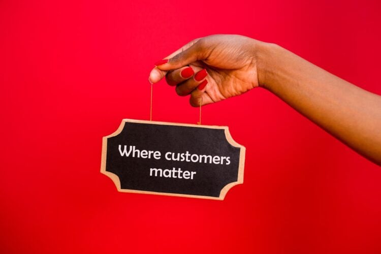 Photo by RDNE Stock project: https://www.pexels.com/photo/hand-of-a-woman-holding-a-hanging-signage-7564241/