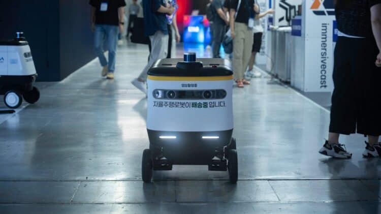 Photo by Youn Seung Jin: https://www.pexels.com/photo/autonomous-delivery-robot-at-tech-conference-32778343/
