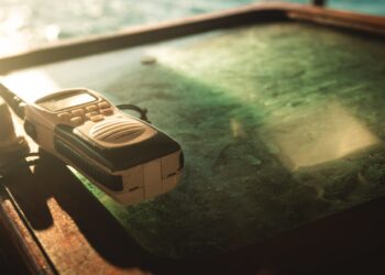 Photo by Athena Sandrini: https://www.pexels.com/photo/close-up-photo-of-white-and-black-two-way-radio-on-green-glass-surface-1586807/