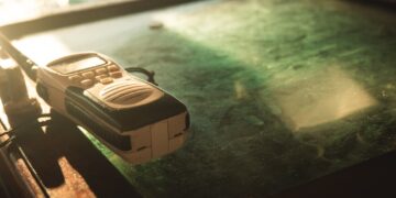Photo by Athena Sandrini: https://www.pexels.com/photo/close-up-photo-of-white-and-black-two-way-radio-on-green-glass-surface-1586807/