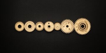 Photo by Miguel Á. Padriñán from Pexels: https://www.pexels.com/photo/photo-of-golden-cogwheel-on-black-background-3785927/