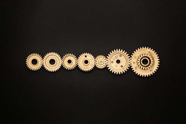 Photo by Miguel Á. Padriñán from Pexels: https://www.pexels.com/photo/photo-of-golden-cogwheel-on-black-background-3785927/