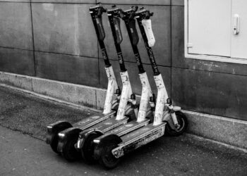 Photo by SHOX art: https://www.pexels.com/photo/black-and-white-image-of-parked-electric-scooters-34265538/
