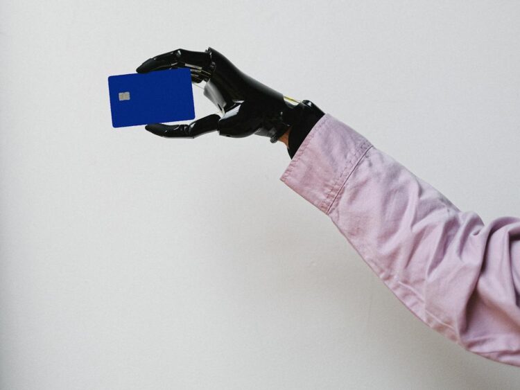 Photo by Anna Shvets: https://www.pexels.com/photo/a-person-holding-a-bank-card-5614107/