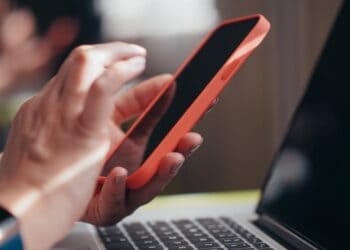 Photo by Kindel Media: https://www.pexels.com/photo/a-person-holding-a-smartphone-7054530/