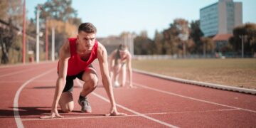 Photo by Andrea Piacquadio: https://www.pexels.com/photo/strong-sportsmen-ready-for-running-on-stadium-3764011/