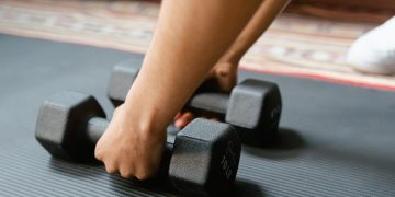 Photo by MART PRODUCTION: https://www.pexels.com/photo/person-holding-black-dumbbells-8032759/