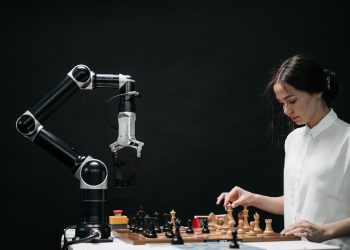 Photo by Pavel Danilyuk from Pexels: https://www.pexels.com/photo/woman-in-white-shirt-playing-chess-against-a-robot-8438951/