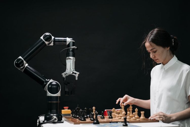 Photo by Pavel Danilyuk from Pexels: https://www.pexels.com/photo/woman-in-white-shirt-playing-chess-against-a-robot-8438951/