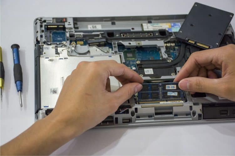 Photo by Elias Gamez from Pexels: https://www.pexels.com/photo/a-hand-fixing-the-internal-parts-of-a-laptop-10558598/