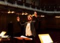 Photo by Jonas Baumann from Pexels: https://www.pexels.com/photo/dynamic-orchestra-conductor-leading-performance-32545976/