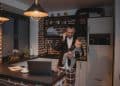 Photo by Tima Miroshnichenko from Pexels: https://www.pexels.com/photo/a-man-in-black-suit-jacket-carrying-baby-while-talking-on-phone-5725565/
